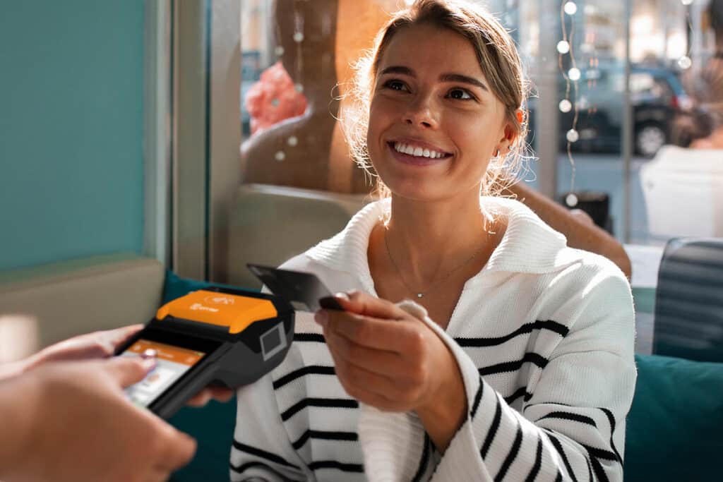 Woman paying with credit card