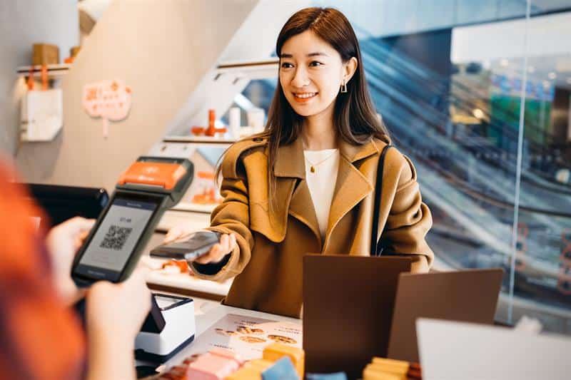 Customer paying using their smartphone on an OTT Pay Credit & Debit Card Machine